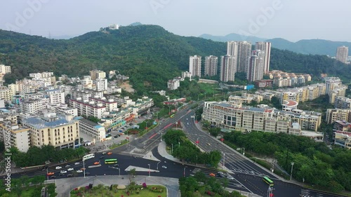 evening time hainan island dadunhai town traffic roads aerial panorama 4k china photo