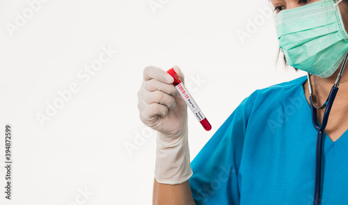 Nurse in blue uniform wear a mask holding test tube sample Coronavirus test blood in the laboratory for analyzing isolated on white background, medicine COVID-19 pandemic outbreak concept