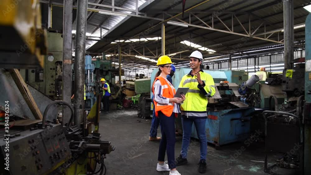 Engineers and industrial workers are working on large machines. Engineers and industrial workers are working on large machines.