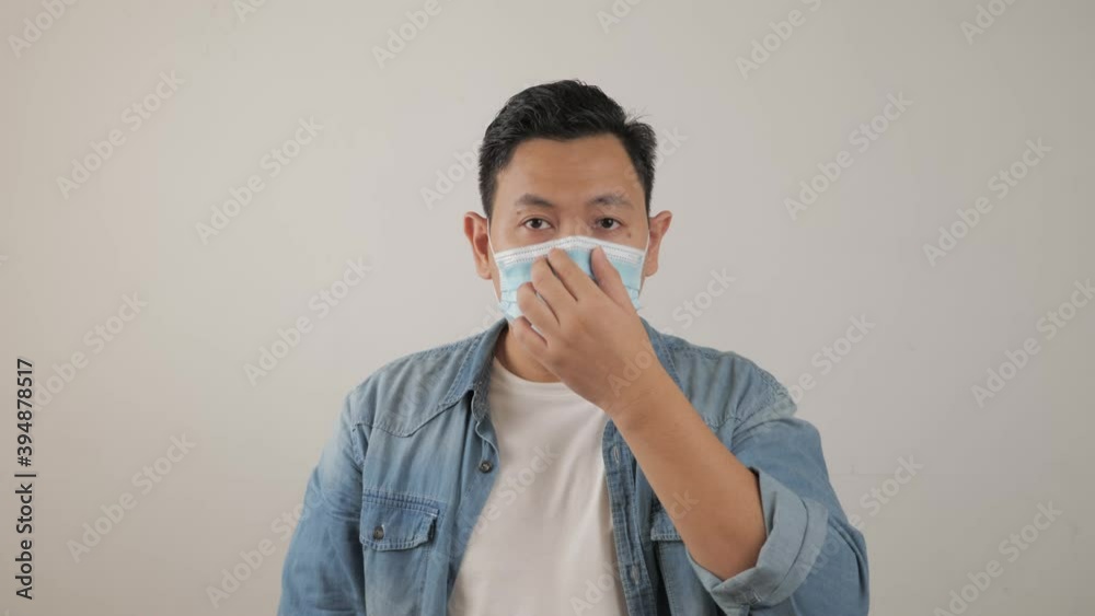 Asian man wearing medical mask coughing hard, covid-19 coronavirus patient, new normal Asian man wearing medical mask coughing hard, covid-19 coronavirus patient, new normal