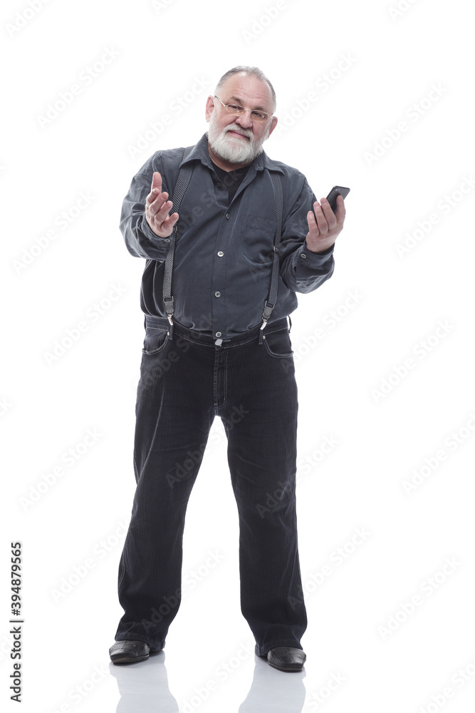 in full growth. friendly elderly man with a smartphone