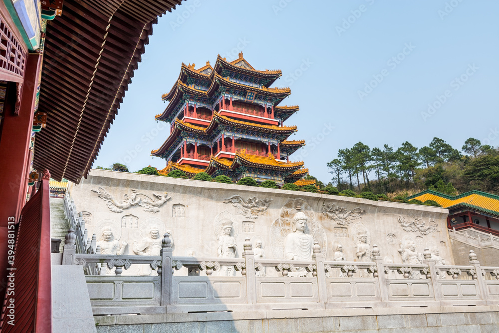 Buddha statue in Chinese traditional royal style Baotuo lecture temple in Putuoshan mountains, Zhoushan Islands, a renowned site in Chinese bodhimanda of the Guanyin Buddha statue in Chinese traditional royal style Baotuo lecture temple in Putuoshan mountains, Zhoushan Islands, a renowned site in Chinese bodhimanda of the Guanyin