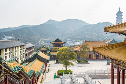 Chinese traditional colorful Baotuo lecture temples in the Putuoshan mountains, Zhoushan Islands,  a renowned site in Chinese bodhimanda of the bodhisattva Avalokitesvara (Guanyin) photo