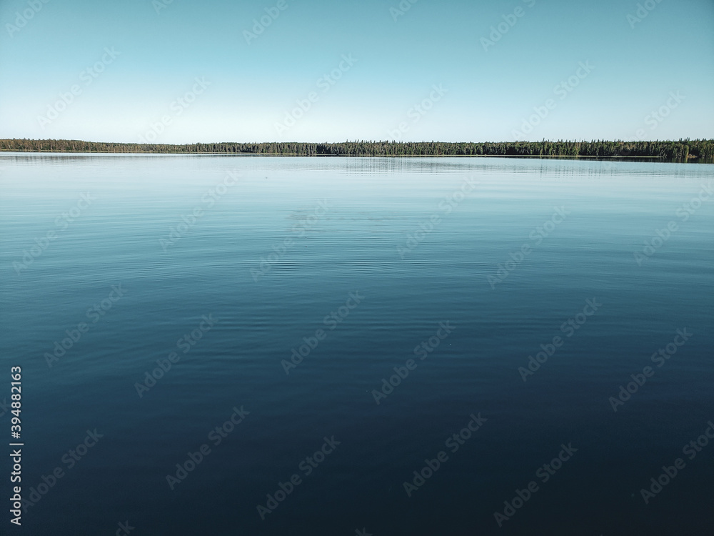 Calm lake at sunrise, Child's Lake, Duck Mountain Provincial Park, Manitoba, Canada