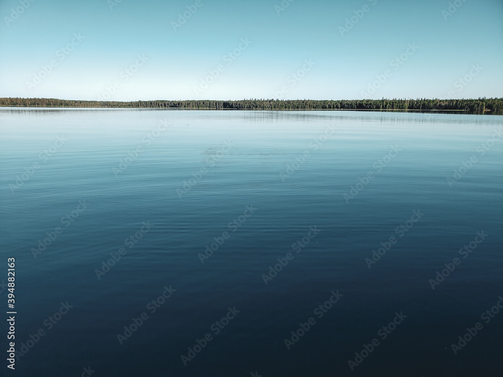 Calm lake at sunrise, Child's Lake, Duck Mountain Provincial Park, Manitoba, Canada Calm lake at sunrise, Child's Lake, Duck Mountain Provincial Park, Manitoba, Canada