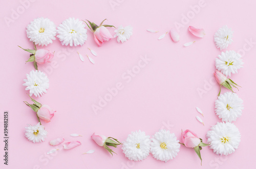 pink and white flowers on pink paper background © Maya Kruchancova