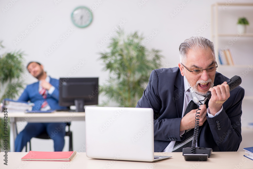 Two employees at workplace during pandemic Two employees at workplace during pandemic