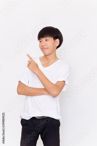 a young man with hand point on empty space
