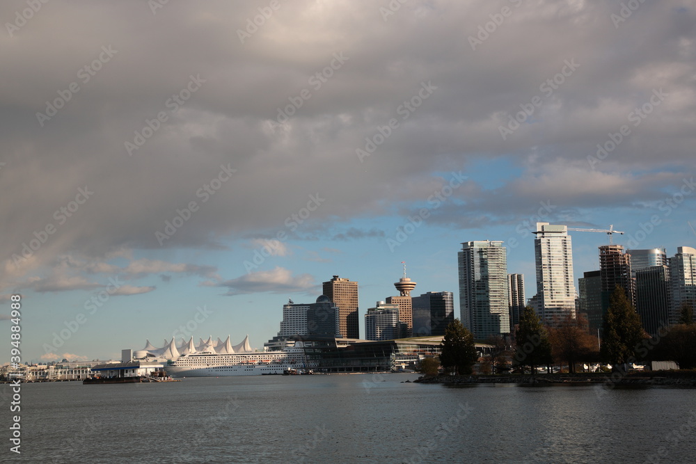 View of Vancouver downtown skyline and coal harbour during springtime seen from Vancouver Stanley Park, British Columbia,  Canada.
