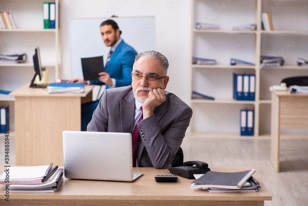 Two male colleagues working in the office