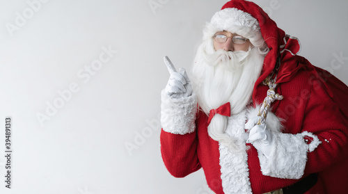close up portrait of santa claus with a bag on his back. Copy space