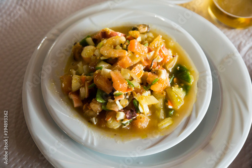 Traditional Spanish seafood salpicon - cold salad from mix of seafood and vegetables
