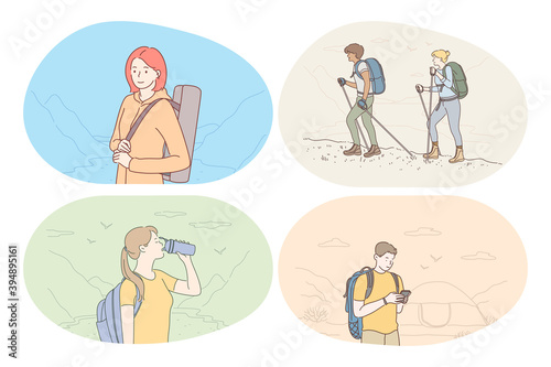 Hiking, tourism, trekking on nature in mountains concept. Young people hikers with backpacks travelling to mountains, orienting on route, drinking water during outdoor vacation. Active sport lifestyle