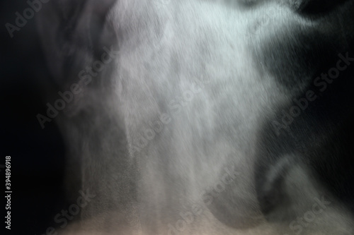 Grey smoke on a black background, fog on a dark background