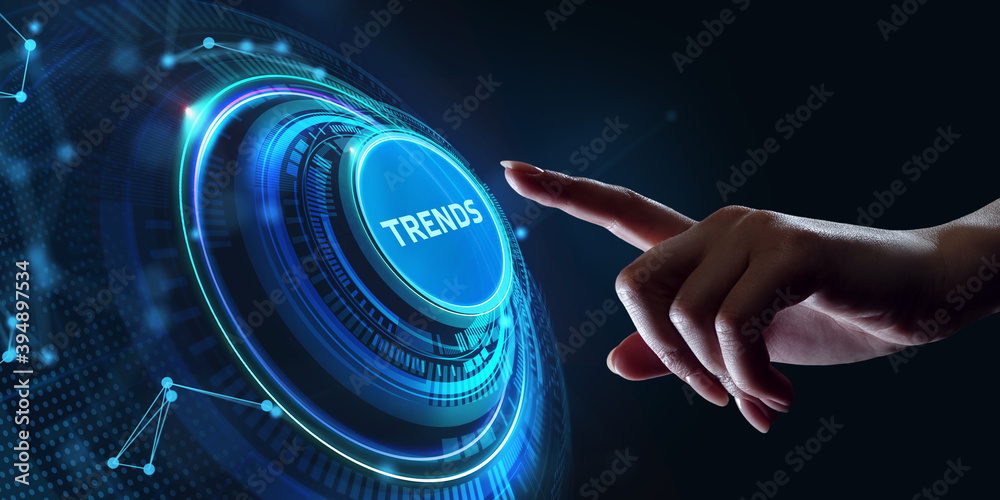 Business, Technology, Internet and network concept. Young businessman working on a virtual screen of the future and sees the inscription: Trends