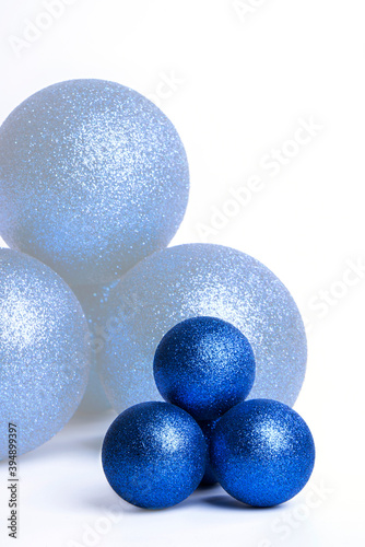 Blue Christmas baubles on a white background.