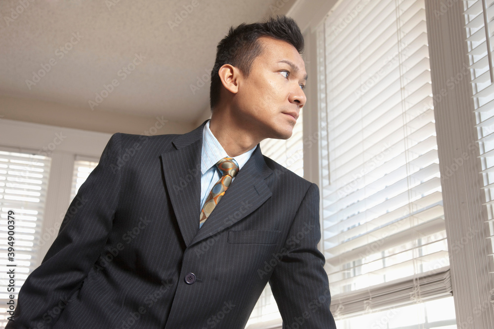 Serious Malaysian businessman in office