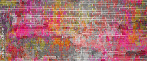 Banner multicolored brick wall. Bright pink yellow and white paint on brick texture.