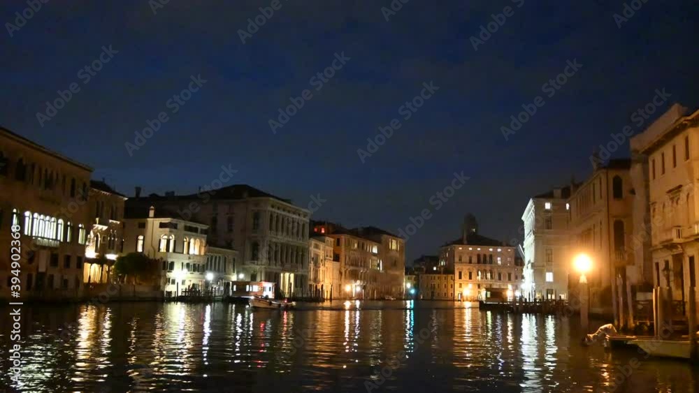 Venice, Italy - November 2020 - The evening lights come on between the palaces and bridges of the Grand Canal Venice, Italy - November 2020 - The evening lights come on between the palaces and bridges of the Grand Canal