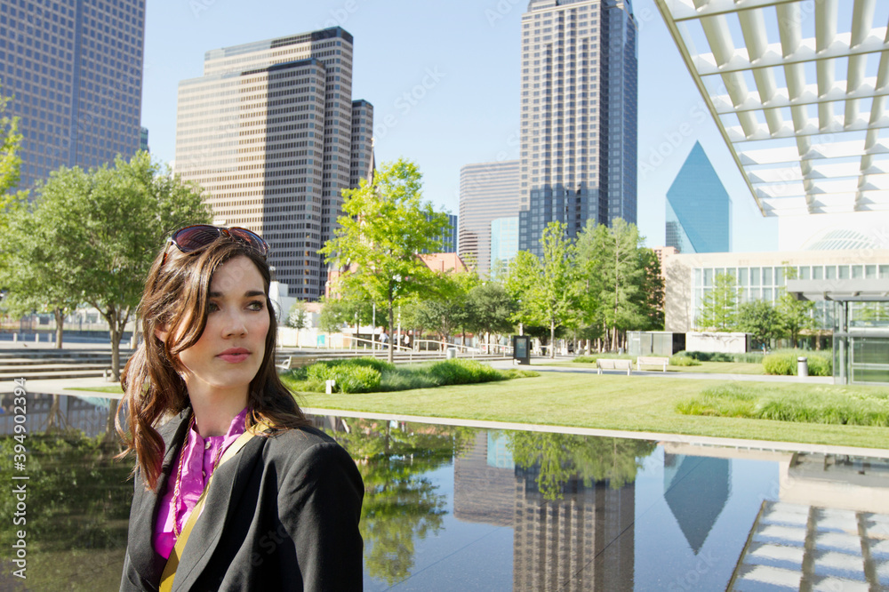 Caucasian woman in urban park, Dallas, Texas, United States Caucasian woman in urban park, Dallas, Texas, United States