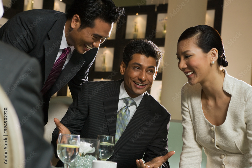 Smiling business people in restaurant Smiling business people in restaurant