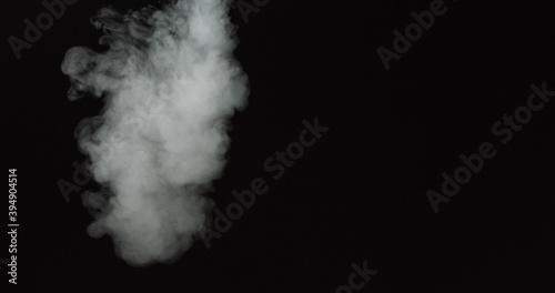 Low density smoke puff spreading concentrically outwards Gunshot smoke Shockwave smoke. Separated on pure black background, contains alpha channel.