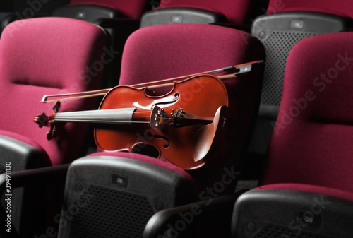 Close up of Violin resting on Auditorium Seats