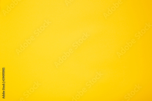 Bright yellow color empty background. Nobody. Clean sheet. Smooth tone. Texture of sunny plaster
