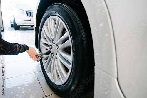 Car Wheels Cleaning with Special Stains and Oil Removing Detergent.