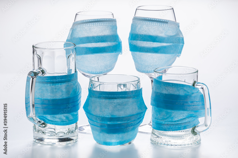 Wine glasses, beer mugs with mask as limitation in pandemic Wine glasses, beer mugs with mask as limitation in pandemic