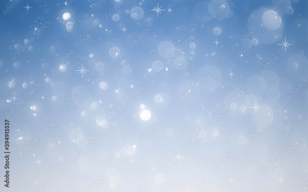 Winter snowfall and snowflakes on light blue background.blue bokeh abstract light backgrounds