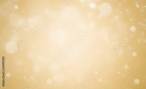 Golden background with soft bokeh lights.