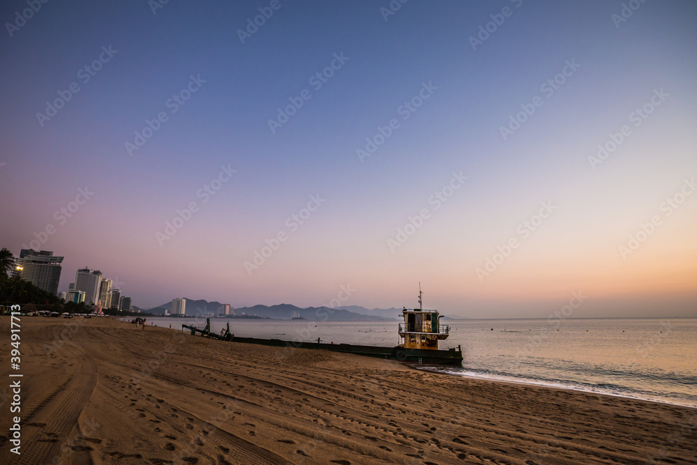Fototapeta premium Sunrise on Nha Trang beach in Vietnam