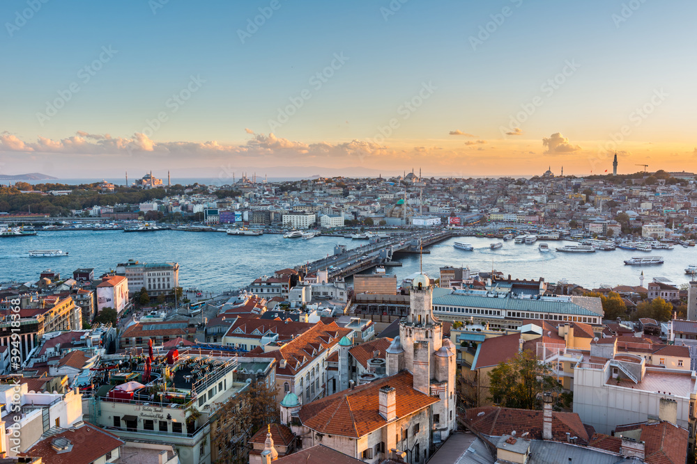 Naklejka premium Aerial view of golden horn in the strait of Bosporus under sunset from the gala tower in Istanbul, Turkey, view from the Galata tower.