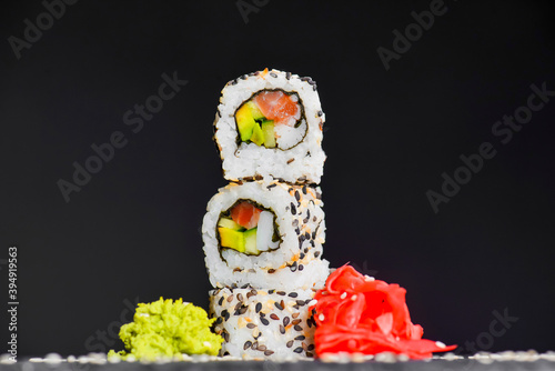 Vibrant sushi set, creative idea concept. Sushi tower, California or Philadelphia sushi rolls.