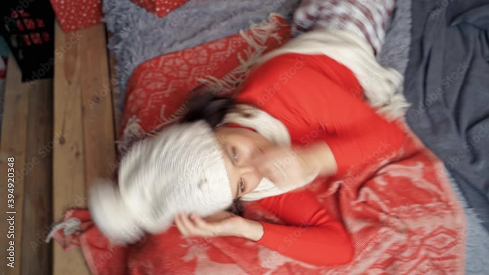 Charming woman laying on bed smiling and posing. Lady looking at camera. New year video. Charming woman laying on bed smiling and posing. Lady looking at camera. New year video.
