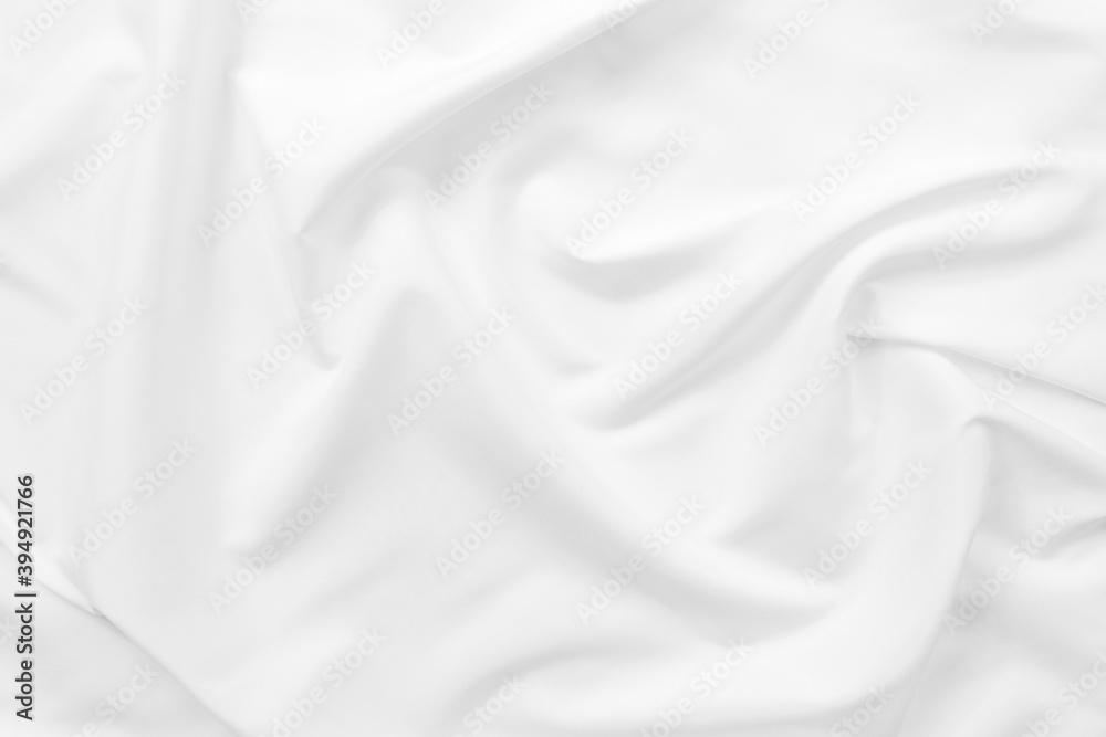 Obraz premium Abstract white fabric texture background. Cloth soft wave. Creases of satin. silk and cotton.