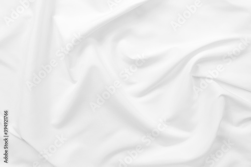 Abstract white fabric texture background. Cloth soft wave. Creases of satin. silk and cotton.