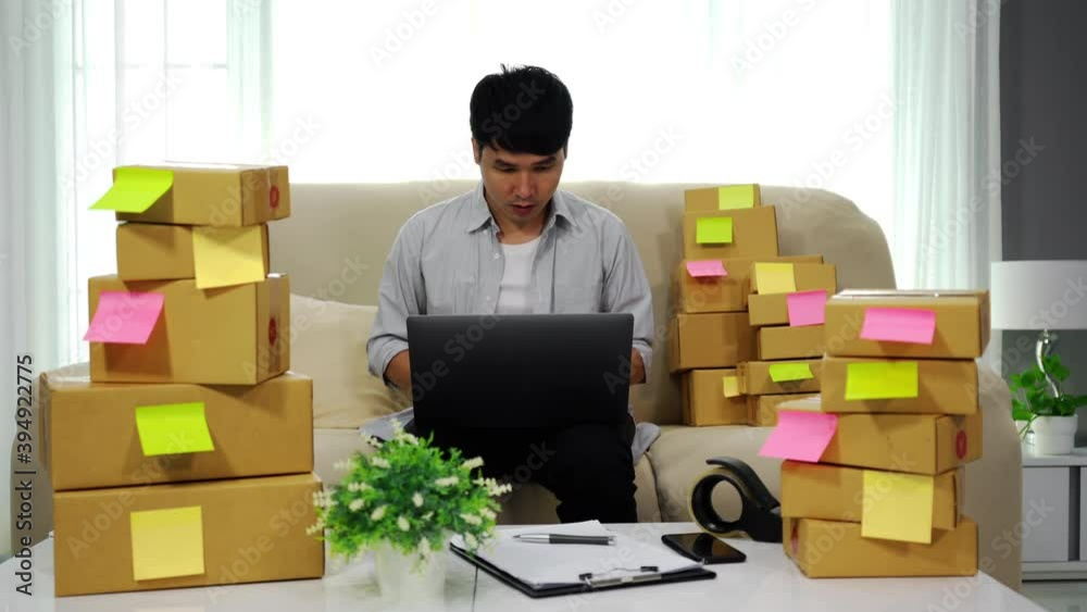 cheerful man entrepreneur working with laptop computer and success to selling product online at home office, (SME business) cheerful man entrepreneur working with laptop computer and success to selling product online at home office, (SME business)