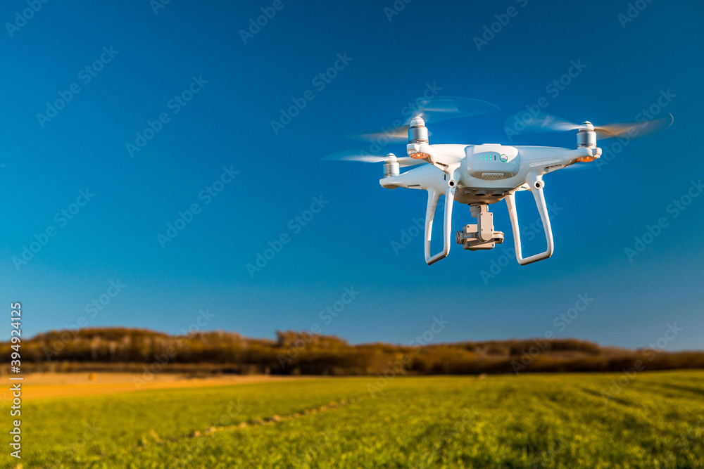 drone quad copter on yellow field drone quad copter on yellow field