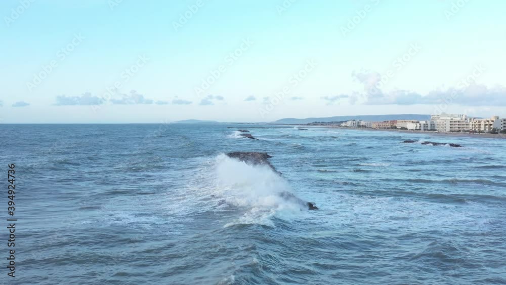 Aerial view of surfers, riding waves after the storm in Palavas les flots, french village near the mediterranean sea Aerial view of surfers, riding waves after the storm in Palavas les flots, french village near the mediterranean sea