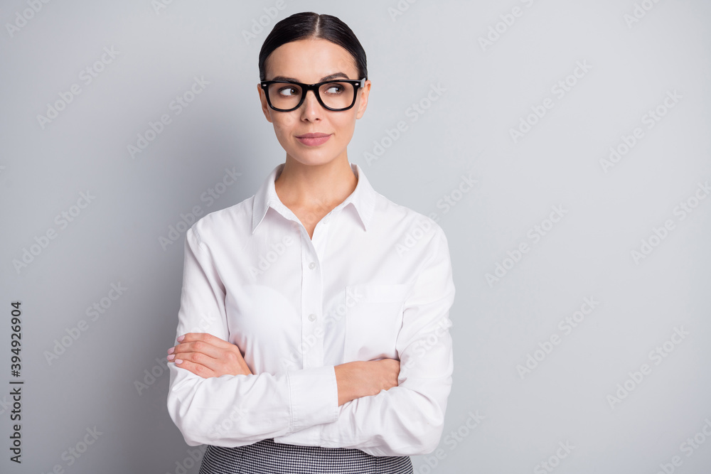 Photo of concentrated business woman folded hands look empty space wear spectacles white shirt isolated grey color background Photo of concentrated business woman folded hands look empty space wear spectacles white shirt isolated grey color background