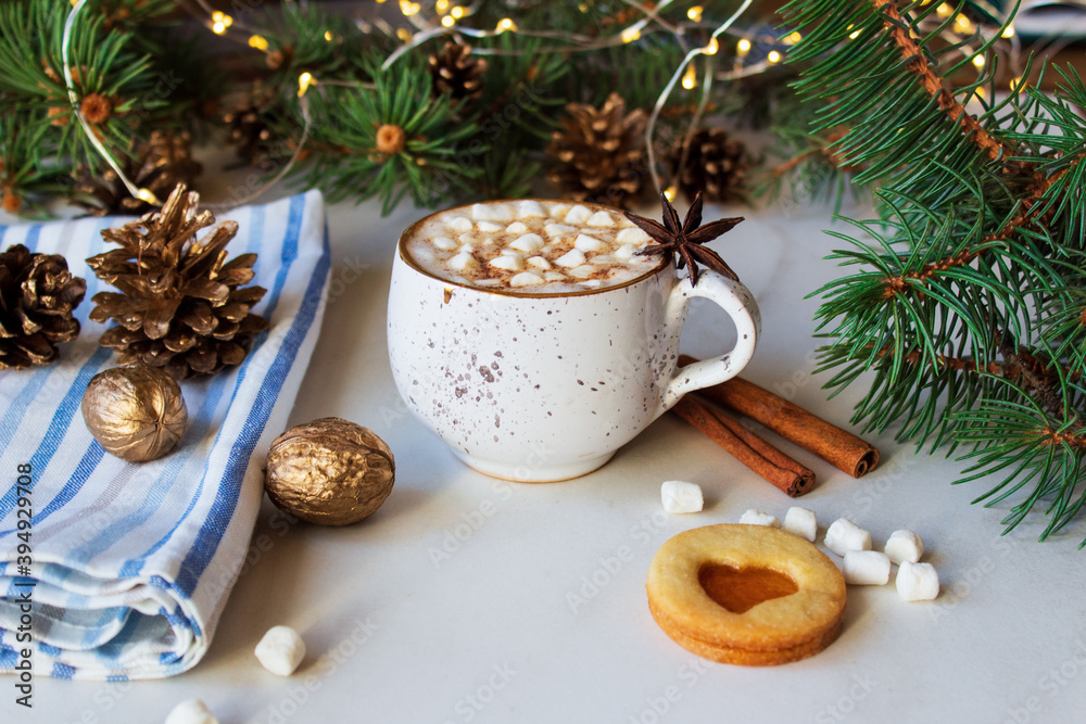 A cup of hot chocolate with marshmallows and linzer cookie on a light background. A cup of hot chocolate with marshmallows and linzer cookie on a light background.
