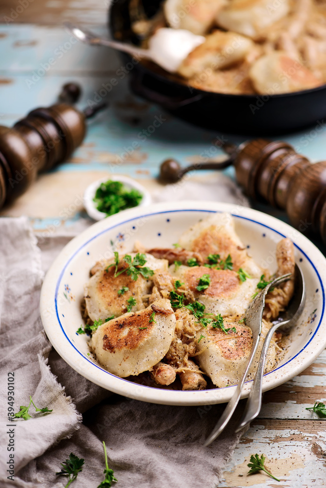 Farmer sausage sauekraut with perogies Traditional Polish dish..style rustic.