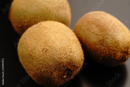 Kiwi fruit on a dark background. Close.