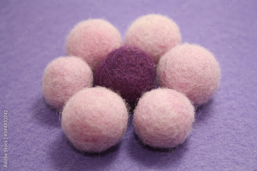 Woolen beads on a violet background. Woolen beads on a violet background.