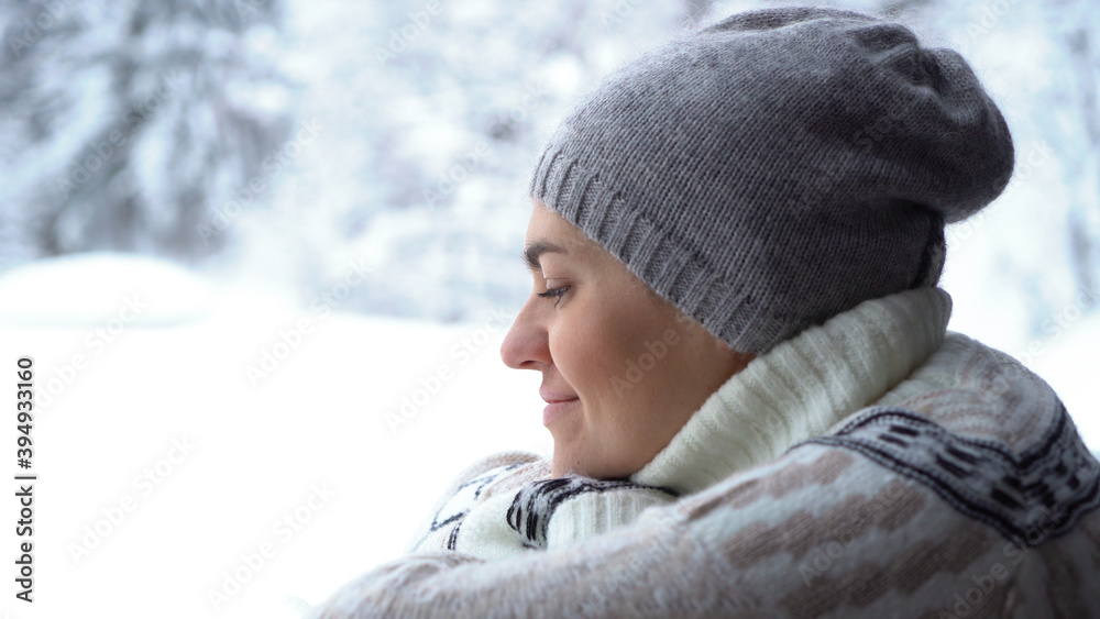 Portrait of happy woman relaxing in winter forest Portrait of happy woman relaxing in winter forest