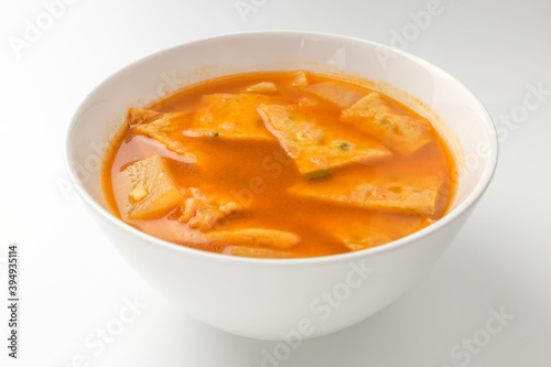 Fish cake soup on a white background