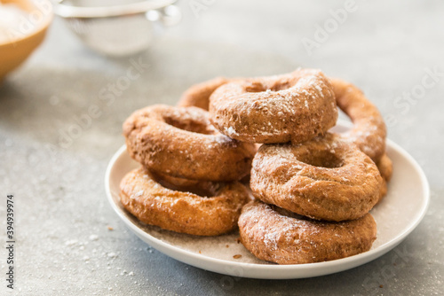 Homemade donuts sugar glazed on a stone background