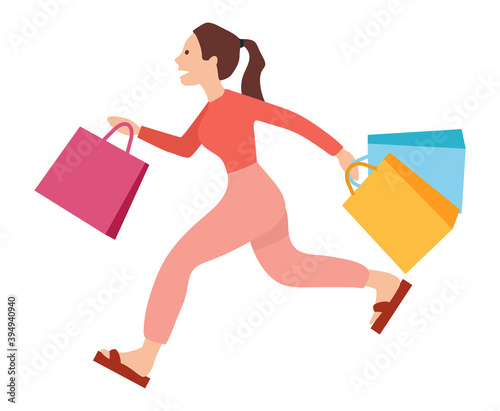 Woman with shopping bags in her hands is running after purchases. Young beautiful fashion shopper girl isolated on white background. Sale advertising. Female character running fast with packages